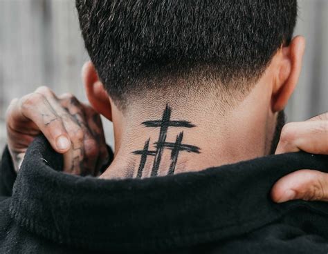 cross on the neck tattoo|More.